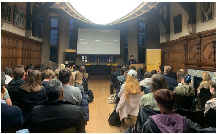 Students watching a company presentation at an OBS event