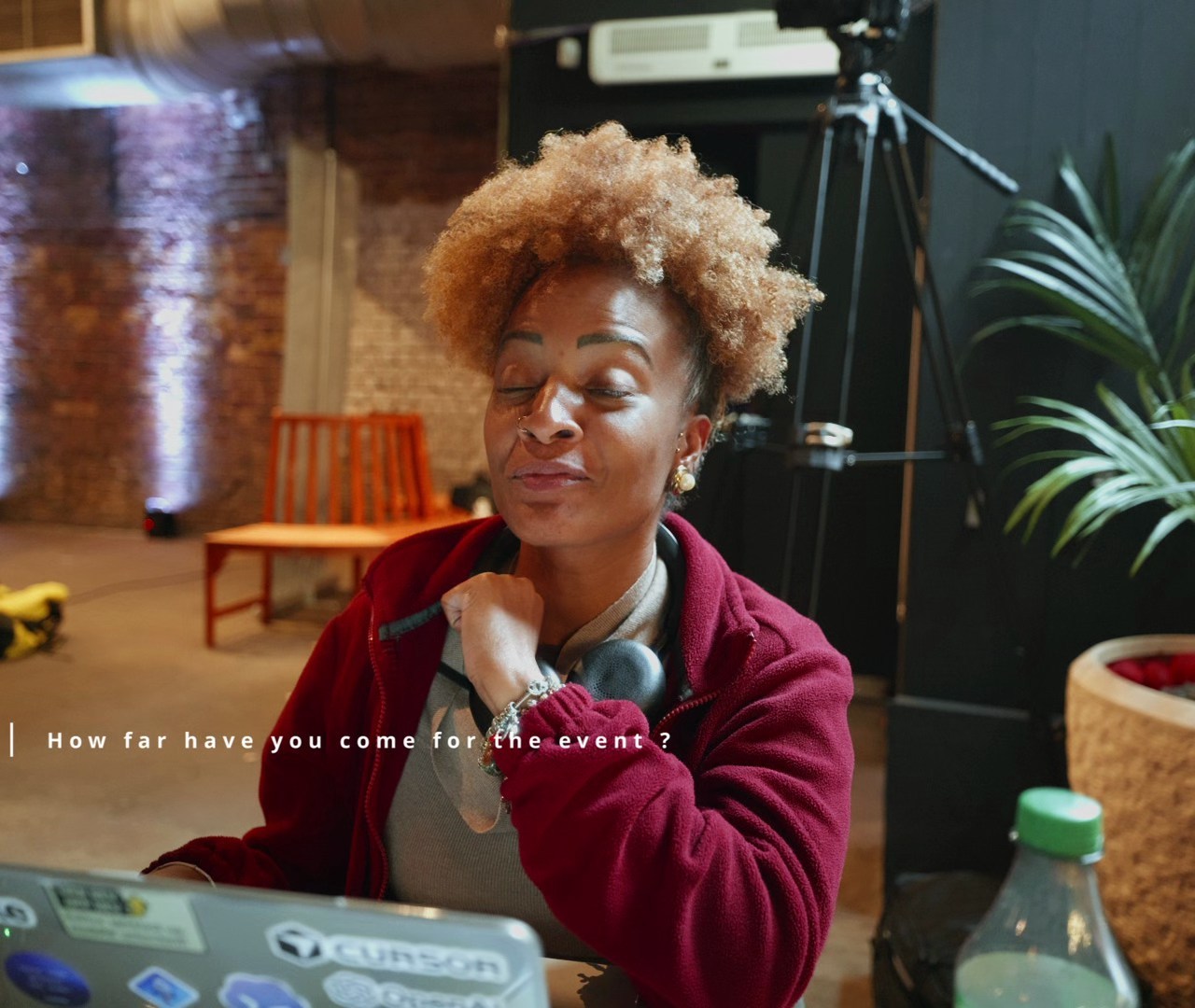 A participant speaking beside her laptop at the CANTOR8 hackathon