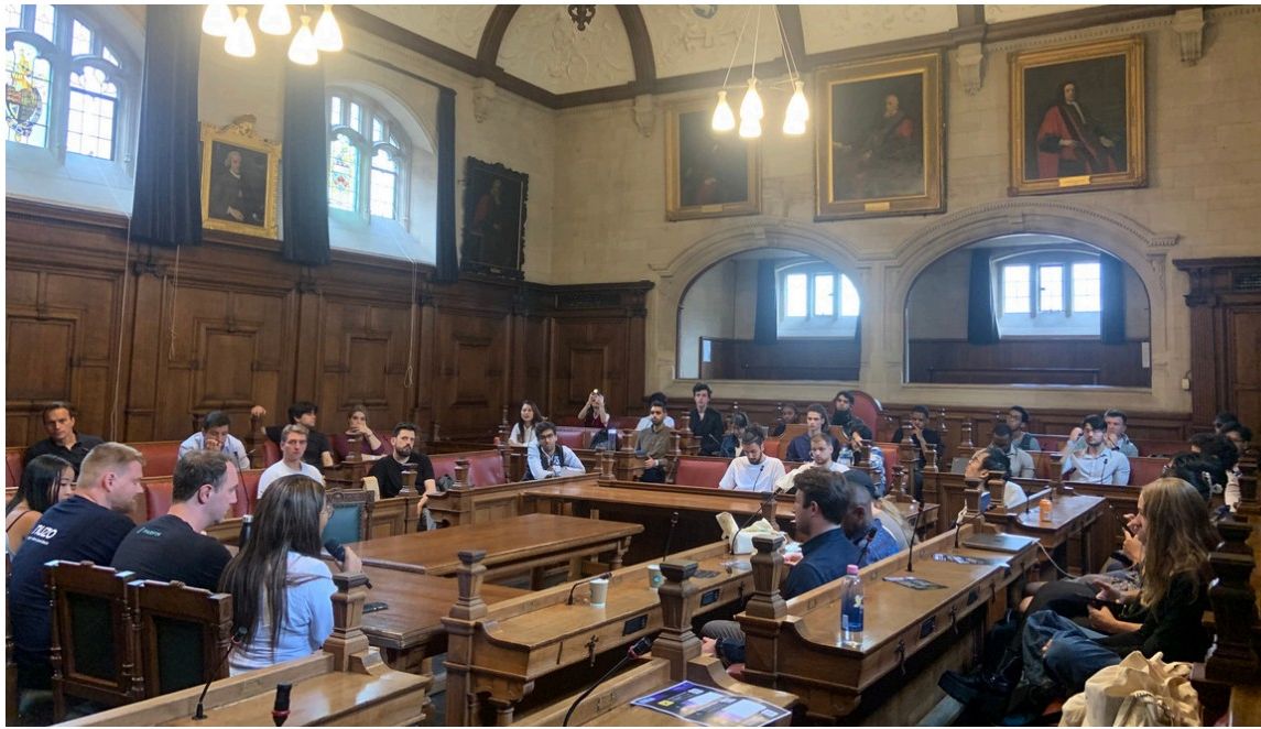 OBS members and speakers gathered in an Oxford debating chamber
